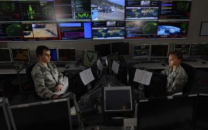 Two U.S. Air Force space and cyber airmen work in the Global Strategic Warning and Space Surveillance Systems Center at Cheyenne Mountain Air Force Station, Colorado, image via afcea.org